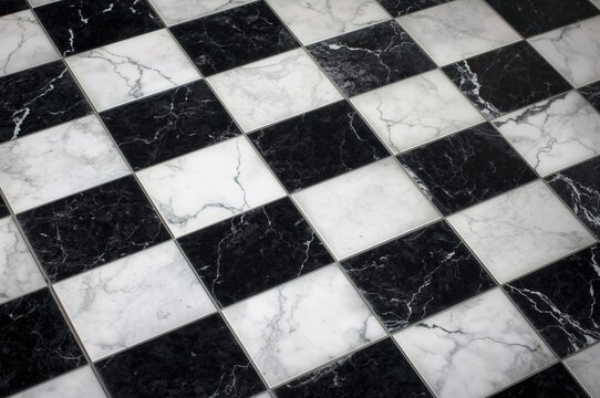Close-up of vintage marble floor featuring black and white checkerboard design