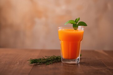 Glass of carrot juice placed on a table