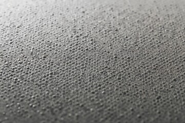 Detailed view of grey CMYK dots on printed paper