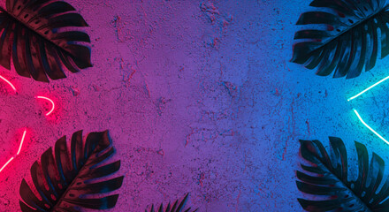 Creative fluorescent color layout made of tropical leaves. Flat lay ultraviolet neon colors. Nature concept. Wall texture summer background.