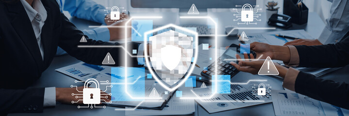 A professional business meeting discussing cybersecurity strategies, featuring a digital shield...