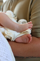 Newborn baby's feet on a canvas. Newborn baptism ceremony.