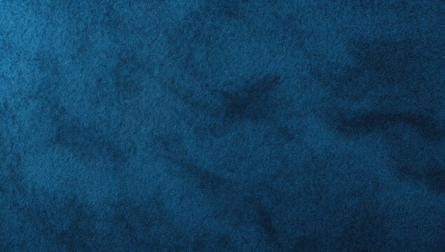 Abstract background of blue felt fabric texture with dark vignette and space for text
