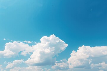 Clear azure sky adorned with stunning fluffy white clouds
