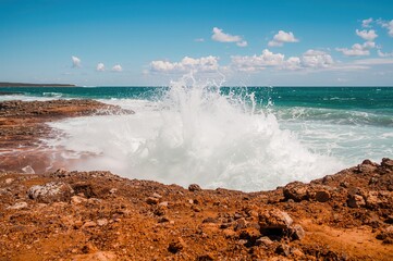 Dynamic water spouts erupting in a remote coastal setting
