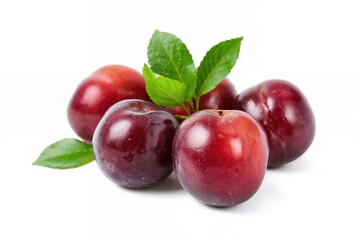 Cluster of mature plums against a plain white backdrop