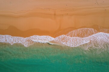 Fototapeta premium Aerial close-up of a deserted sandy shore
