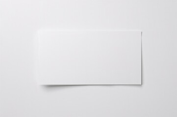 A pristine white card set against a plain backdrop