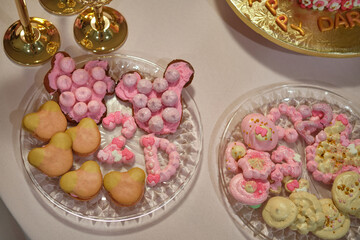 Homemade cookies and pastries for a girl’s birthday party in pink style