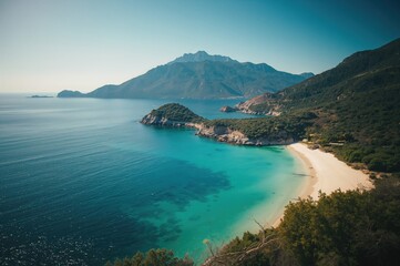 Fototapeta premium Stunning seaside views of a rocky promontory with water, shore, sunshine, natural surroundings, terrain, ocean, hills, dark tones, ecosystem, picturesque
