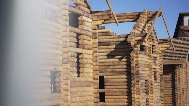 Construction site with wooden log houses
