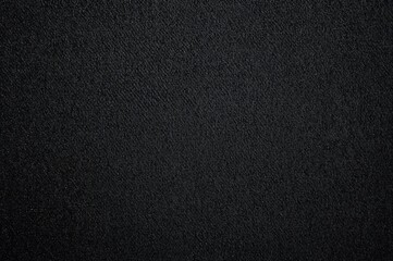 Fototapeta premium Dark denim fabric surface close-up