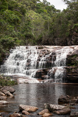 Authentic landscape photography from Vale do Pati in Chapada Diamantina, Bahia Brazil featuring towering mountains, soft mist, dense deep-green vegetation and diffused natural light. Moist atmosphere 