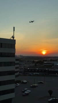 SLOW MOTION SHOT - An airplane flies in the sky at sunset. An airplane takes off against the background of sunset from the Toronto Pearson International Airport, Canada.