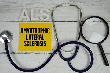 ALS Amyotrophic Lateral Sclerosis text with Stethoscope on wooden background