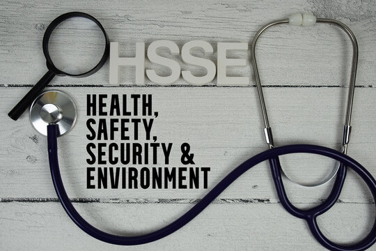 HSSE Health, Safety, Security & Environment text with Stethoscope on wooden background