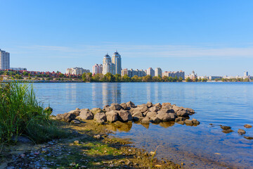 Scenic View of Obolon Embankment with Modern Skylines and Serene Waters in Kyiv
