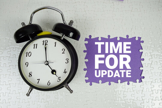 Time for Update text with alarm clock on purple background