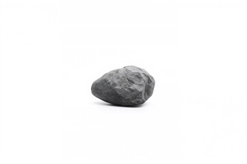 Fototapeta premium Single gray rock against a plain white backdrop