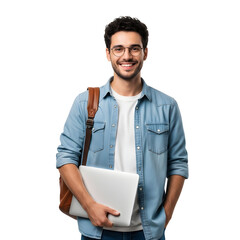 A young man wearing a denim shirt and glasses, holding a laptop and a backpack, smiles confidently while standing against a white background