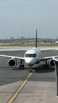 Mississauga, Ontario, Canada, June 16, 2025: SLOW MOTION SHOT - Air Canada commercial aircraft arrives at the Toronto Pearson International Airport.