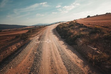 Aerial drone perspective of a gravel rural pathway