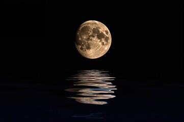 Complete lunar orb mirrored on water surface