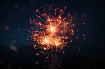 Fototapeta premium Sparklers and fireworks glowing against a deep blue backdrop with bokeh effects
