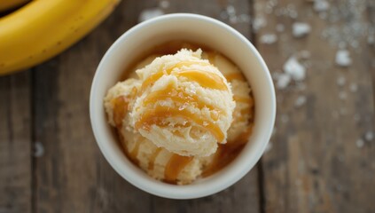 Top view of a bowl filled with banana-flavored ice cream