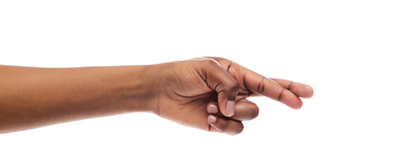 Fototapeta premium Black female hand with crossed fingers for luck, isolated on white background, panorama