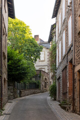 Walking in Uzerche, historical fortified royal patronage medieval town in Correse department, Nouvelle-Aquitaine, France, old houses and narrow streets