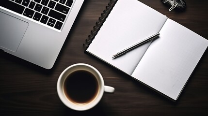 Laptop, notebook, and coffee on a wooden desk