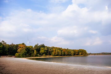 Windmills, sustainable energy, beach, lake