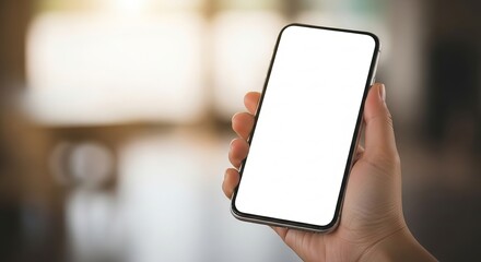 Modern smartphone mockup held in hand, displaying a blank white screen for innovative mobile app designs, responsive website showcases, or digital content presentations in a bright, adaptable setting