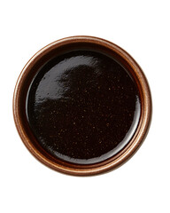 a small. round brown ceramic bowl filled with a thick. dark brown sauce or condiment the glossy surface reflects light. indicating a rich texture. commonly used in cooking or as a dip culinary themes