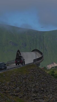 Cars driving on the spectacular bergsbotn viewpoint platform in norway
