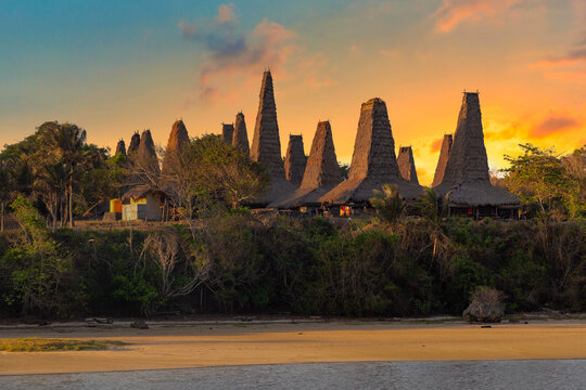 Traditional village of Ratenggaro with the traditional houses at the western site of Sumba island, Indonesia during colorful sunset
