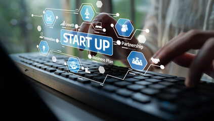 Fototapeta premium A close-up image depicting hands typing on a keyboard with visual elements highlighting start up concepts, including growth, innovation, and partnership in a modern workspace. Tessel