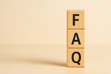 Minimalist FAQ Concept with Wooden Blocks on Beige Background