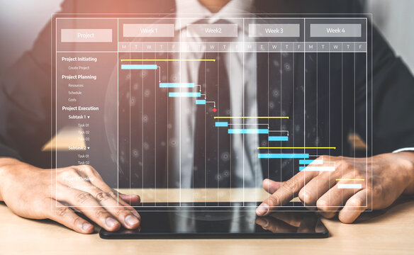 A business professional interacts with a digital Gantt chart on a tablet to enhance project management efficiency, showcasing a modern approach to scheduling and planning. Tessel