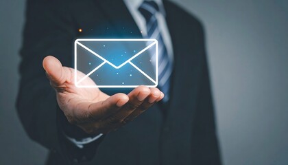 Professional businessman presenting holographic envelope icon for modern digital business communication