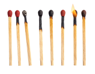 Matchsticks in a row, various stages of burning