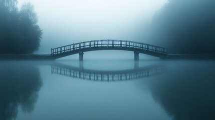 Misty morning, arched bridge reflecting on calm lake, peaceful scene