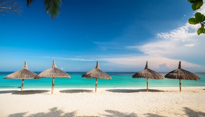 Fototapeta premium The Tranquil Beach Scene With Thatched Umbrellas And Crystal Clear Ocean