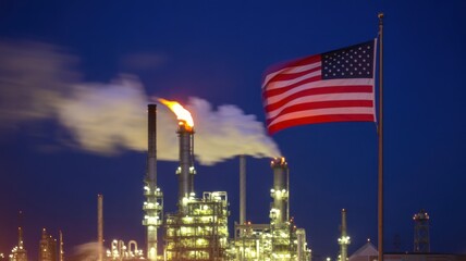American flag waving proudly in front of an industrial oil refinery at night, symbolizing the energy industry and national pride