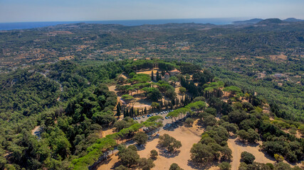 Ancient trees and ruins on hilltop landscape