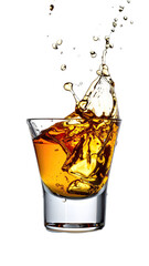 A shot glass of amber liquid, with ice cubes, erupting in a splash