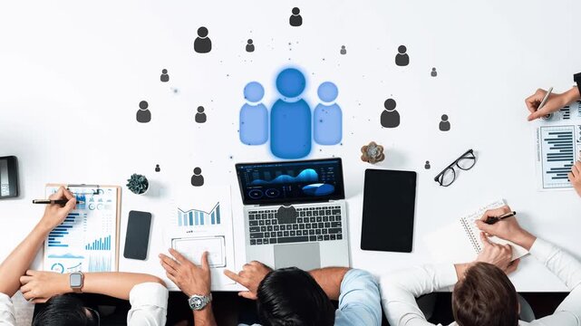 This image showcases a collaborative work environment, emphasizing teamwork among professionals using digital devices for data analysis and innovative brainstorming sessions. Raster - Powered by Adobe