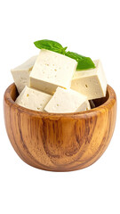 Cubes of pale, creamy cheese in a wooden bowl with a sprig of green herb