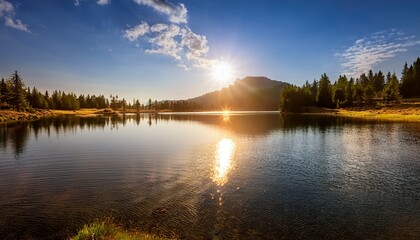A Serene Lake With A Sun Reflecting On The Water